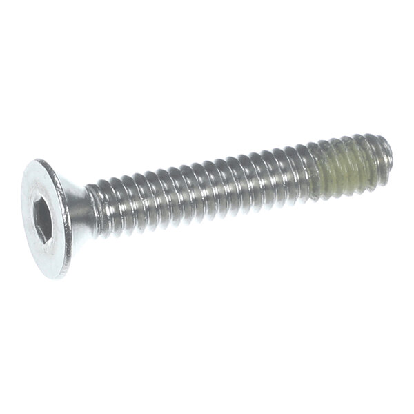A metal screw with a flat, hexagonal socket head and threaded shaft, partially coated with a yellowish substance near the tip.