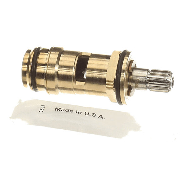 A brass and metal cylindrical mechanical component with grooves and O-rings, accompanied by a label that reads 'Made in U.S.A.'