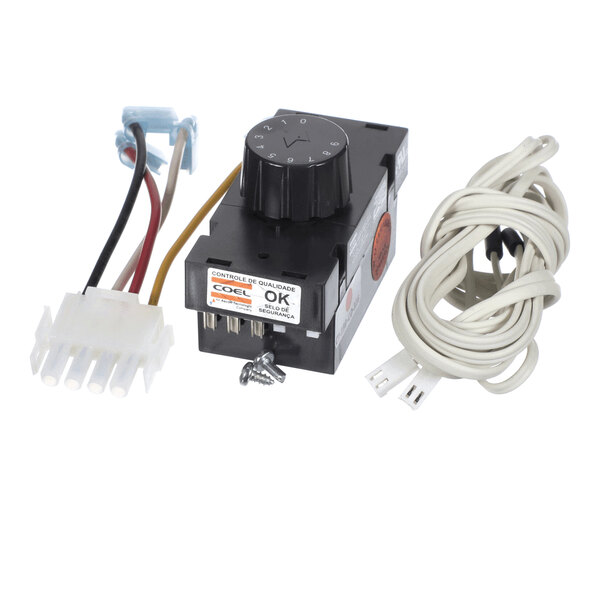 A black electronic control unit with a rotary dial, attached wires, a white connector, and a coiled white cable with a sensor at the end.