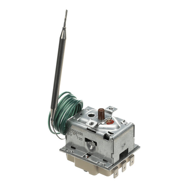 A metal thermostat device with a coiled green wire and a probe attached, featuring several electrical terminals at the base.