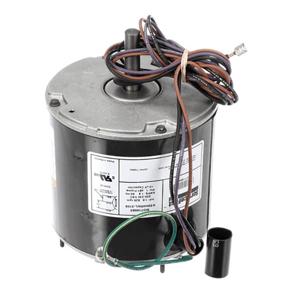 A cylindrical electric motor with attached wires and a label, shown alongside a small black cylindrical component.