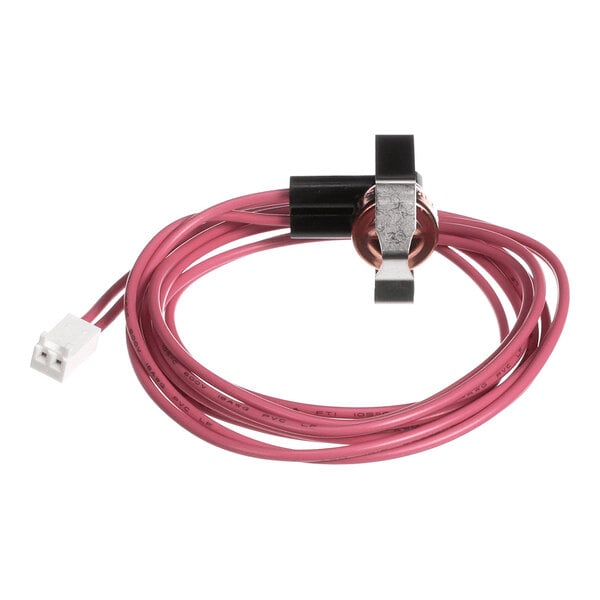 A coiled pink wire with a white connector on one end and a small black and copper component with a metal clip on the other end.