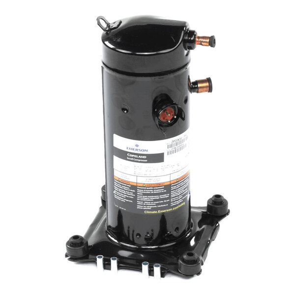 A black cylindrical mechanical component with copper pipe fittings and a label, mounted on a square metal base.