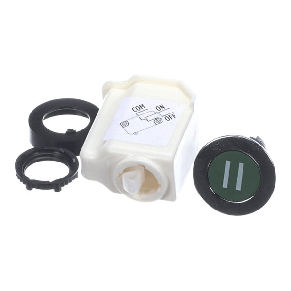 A round green button with a pause symbol, a white plastic housing with a wiring diagram, and two black mounting rings.