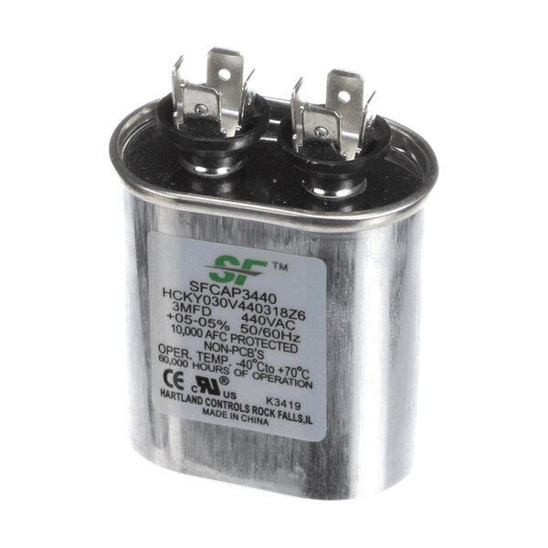 A metallic oval-shaped capacitor with two terminal connectors on top and a label displaying technical specifications.