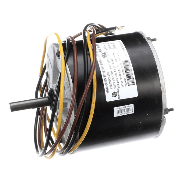 A cylindrical electric motor with attached wires and a protruding shaft, featuring a label with technical specifications.