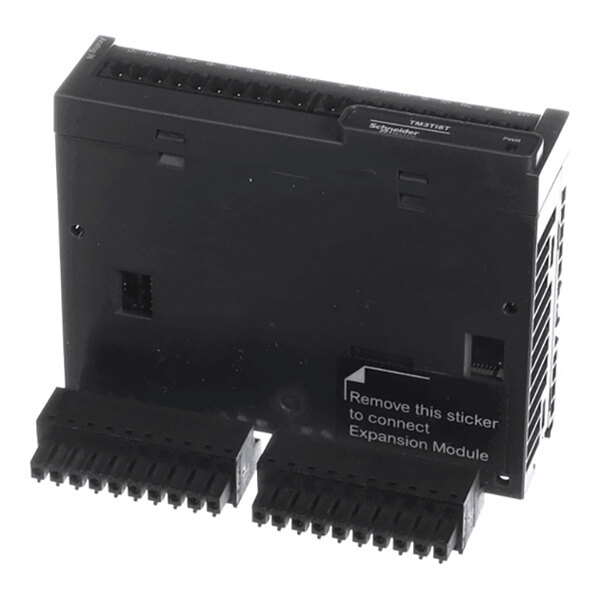 A black electronic module with multiple terminal connectors and a sticker indicating where to connect an expansion module.