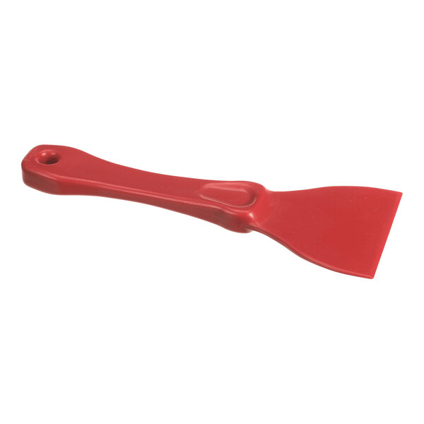 A red plastic scraper with a flat, wide blade and a handle featuring a hole for hanging.
