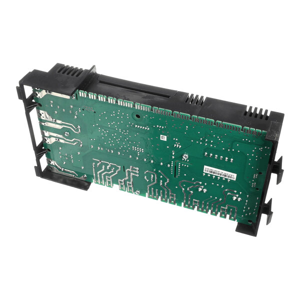 A green printed circuit board (PCB) with various electronic traces and components, partially enclosed in a black plastic frame.