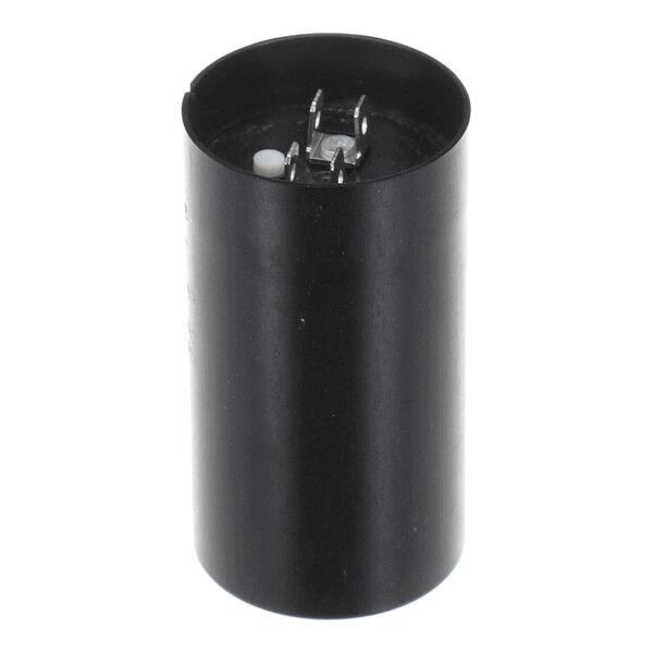 A black cylindrical component with two metal terminals and a white protrusion on the top surface.