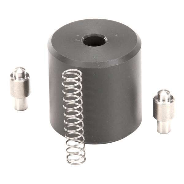 A cylindrical black component with a central hole, accompanied by a metal spring and two small metal pins.