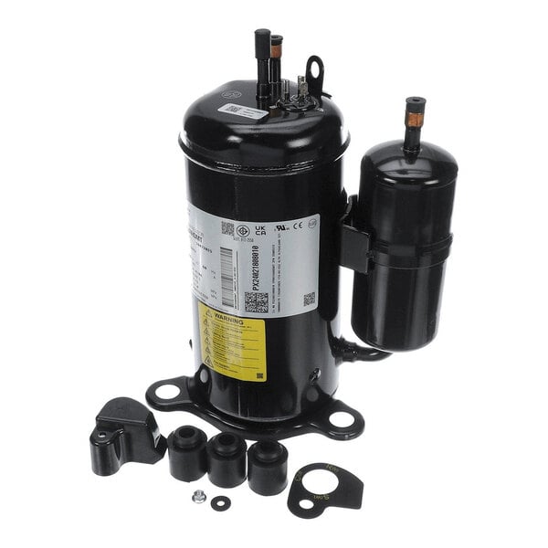 A black cylindrical mechanical component with attached parts and several small accessories arranged in front of it, including rubber mounts and metal brackets.