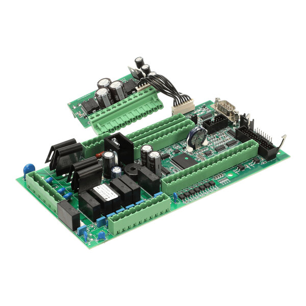 A green electronic control board with various capacitors, relays, connectors, and integrated circuits mounted on it.