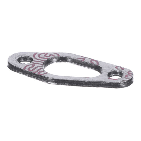 A thin, metallic gasket with two bolt holes and a central irregular opening, viewed from an angle.
