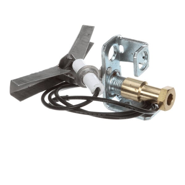 A metal assembly with a brass fitting, a white ceramic component, black wires, and a metal bracket, likely part of a flame protection or ignition system.