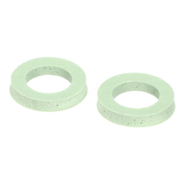Two light green, round, flat gaskets with central holes, shown on a white background.