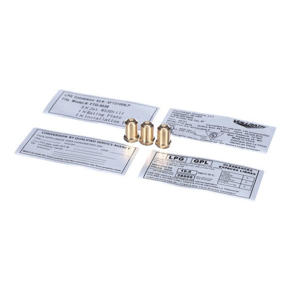 Three small brass fittings are placed in the center, surrounded by four rectangular instruction or information labels on a white background.