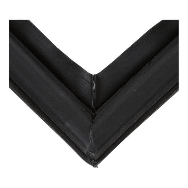 A close-up view of a black rubber-like gasket forming a right angle.