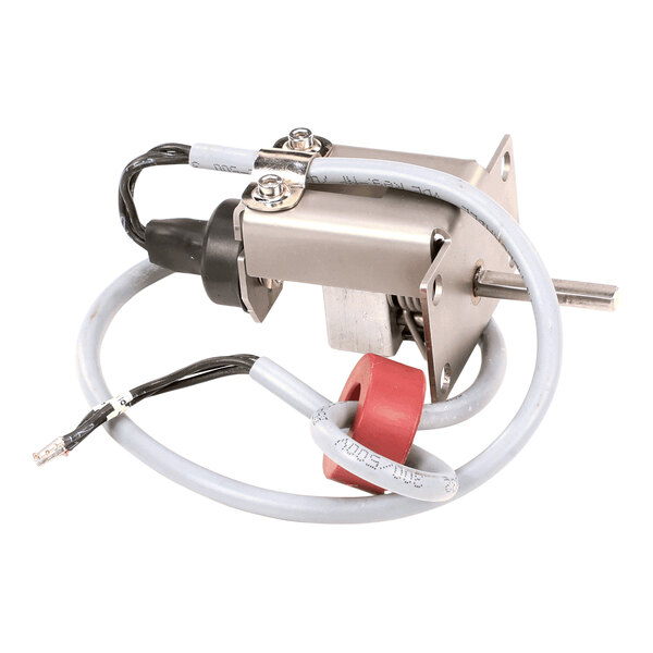 A metallic electrical switch component with attached wires and a red circular element.