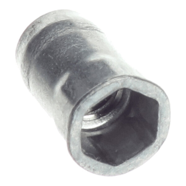 A close-up view of a metallic hexagonal insert nut with internal threading.