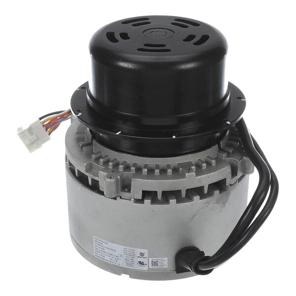 A cylindrical electric motor with a black top cover, visible wiring, and a metal housing with a label.
