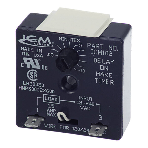 A black electronic timer device with a central adjustment knob, labeled with time increments and connection terminals at the bottom.