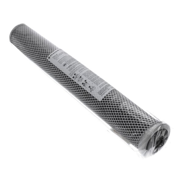 A cylindrical filter cartridge with a mesh exterior, wrapped in clear plastic packaging and labeled with instructions.