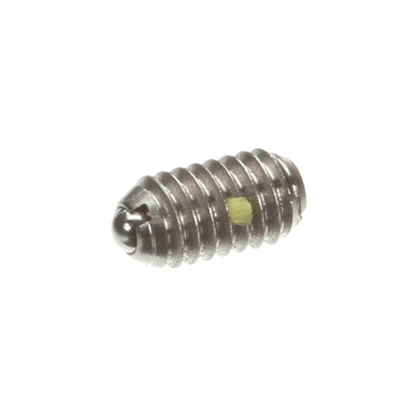 A small, metallic, threaded set screw with a rounded end and a visible yellow marking on its side.
