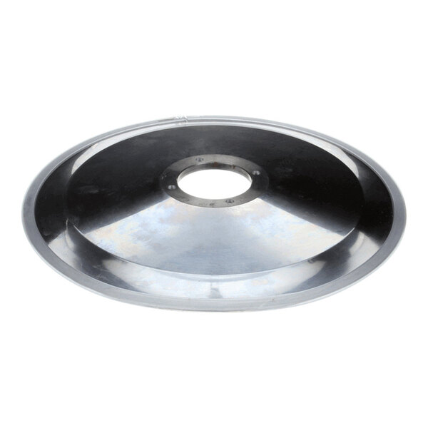A round, metallic, concave disc with a central hole and a reflective surface.