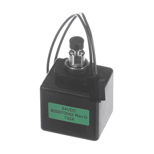 A black rectangular device with a metal plunger on top, two attached wires, and a green label displaying '24VDC 620070042 Rev.D 1324'.