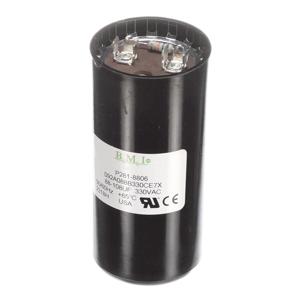 A cylindrical black capacitor with two metal terminals on top and a white label displaying technical specifications.