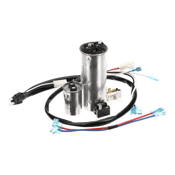 A set of electrical components including two cylindrical capacitors, a relay, a switch, and several wires with connectors.