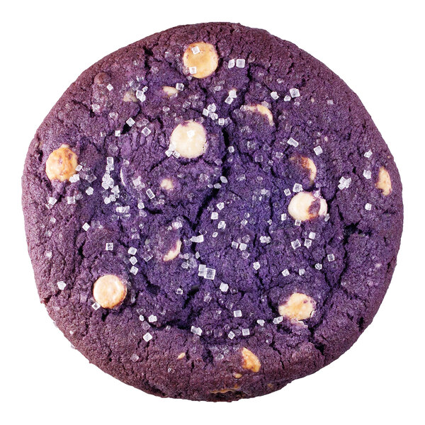 A round, purple cookie with white chocolate chips and sprinkled coarse sugar on top.