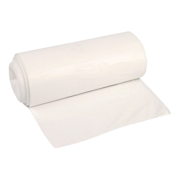 A roll of large, clear plastic bags partially unrolled on a white background.