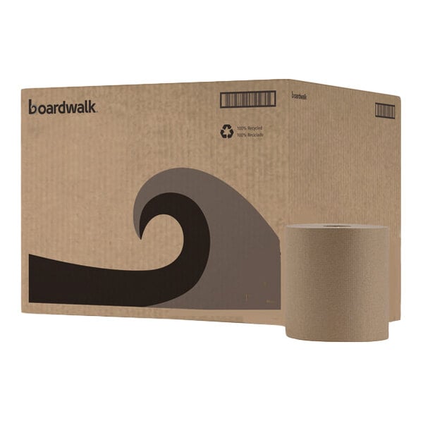 A large brown cardboard box with a wave graphic and a single brown paper towel roll placed in front of it.