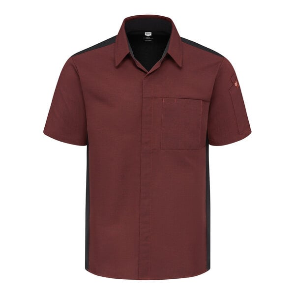 A short-sleeve, button-up shirt in a dark red color with black side panels, a chest pocket, and a collar.