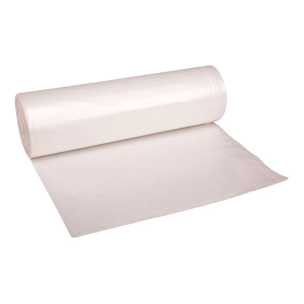 A large roll of clear plastic liner or trash bag partially unrolled on a white background.