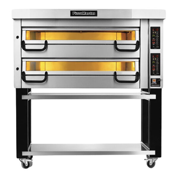A stainless steel double-deck electric oven with illuminated chambers, control panels on the right side, and a lower storage shelf on wheels.