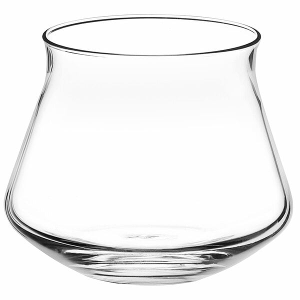 A clear, wide-bottomed glass with a flared rim, designed for tasting beverages.