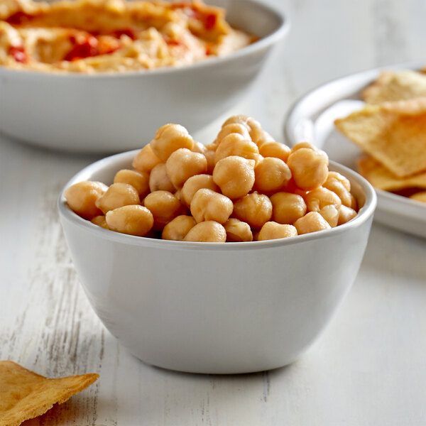 A bowl of Furmano's organic chickpeas served with chips.