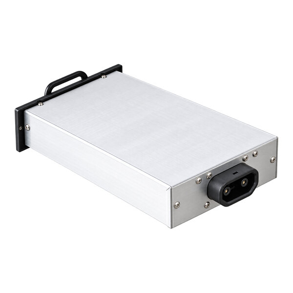 A rectangular metallic device with a handle on one end and a power connector on the other, resembling a battery pack.