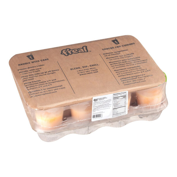 A sealed case containing twelve cups of frozen mango smoothie, partially visible through the clear plastic packaging.