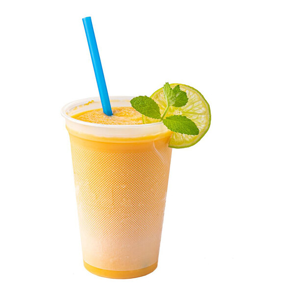 A plastic cup filled with a yellow-orange smoothie, garnished with a lime slice and mint leaves, and a blue straw.