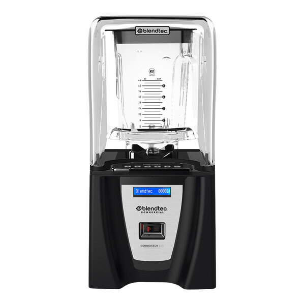 A black and silver blender with a clear sound enclosure and a large transparent blending jar, shown from the front.