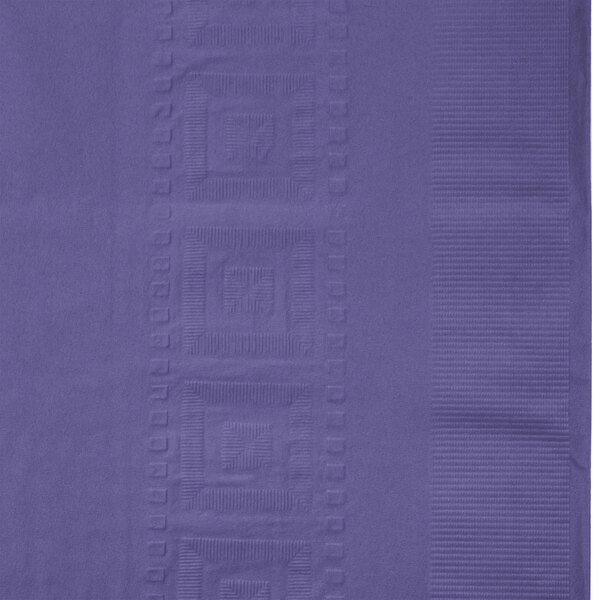 A close-up of a purple tissue / poly table cover with an embossed design.