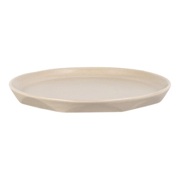 A round, beige-colored plate with a slightly raised rim and a smooth surface.
