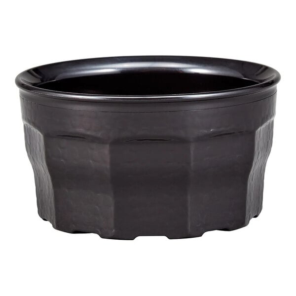 A black, round, plastic bowl with a textured exterior and a smooth rim.