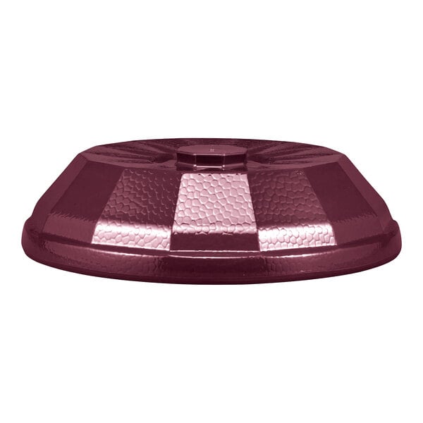 A maroon, low-profile, textured dome-shaped cover with a faceted design and a small central handle.