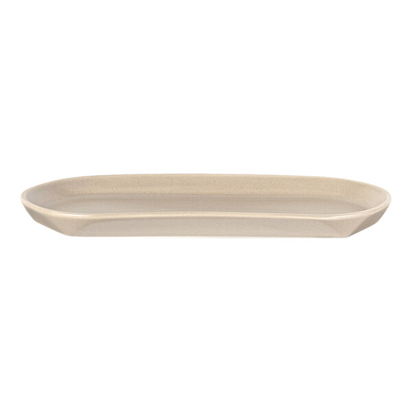 A beige, oval-shaped plate with slightly raised edges, shown from the side against a white background.