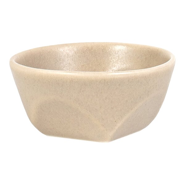 A small, round, beige bowl with a smooth, slightly glossy surface.